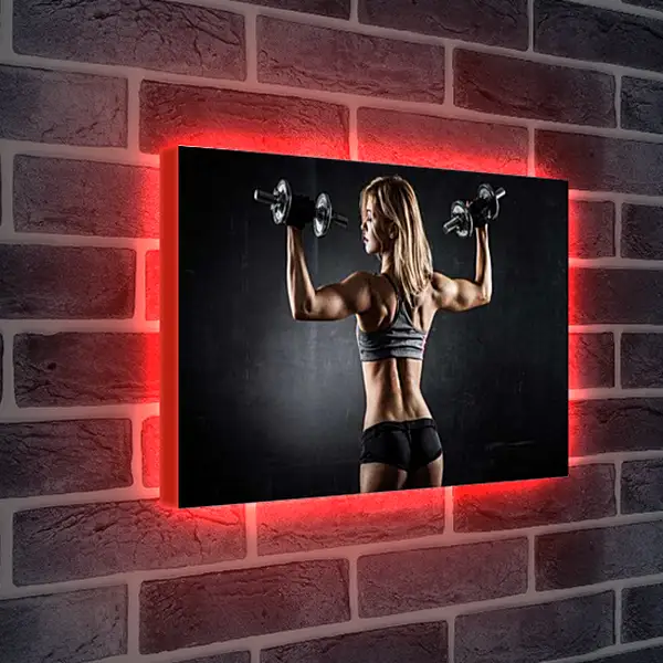 Лайтбокс световая панель - Блондинка стоит спиной и работает с гантелями