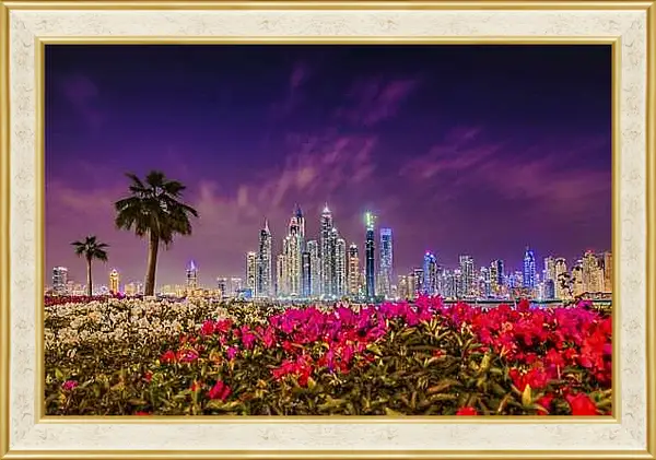 Картина в раме - Клумбы цветов на фоне пальм и города. Дубай
