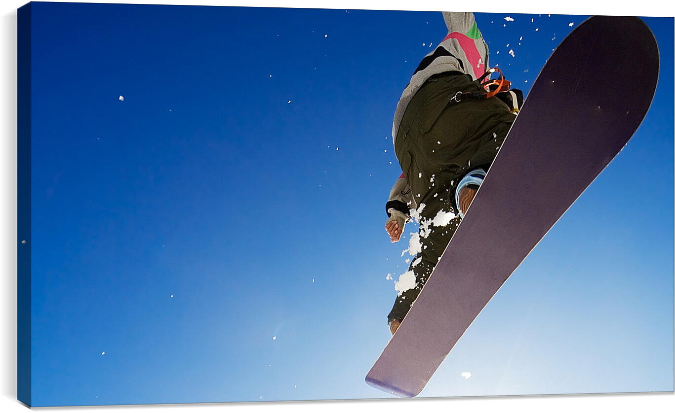 Постер и плакат - Прыжок сноубордиста на фоне чистого неба