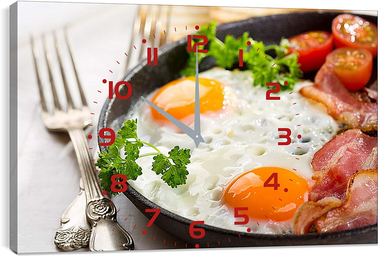 Часы картина - Две вилки и сковородка яичницы на столе